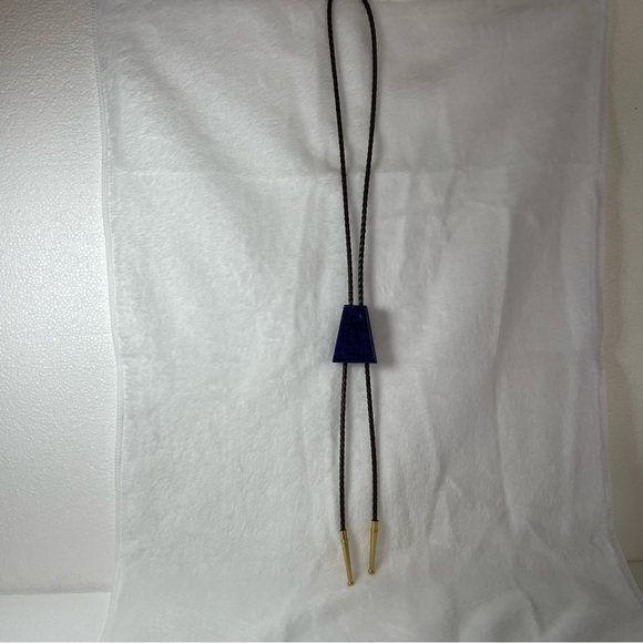 Lapiz handout Bolo tie 19” faux leather with gold colored ends